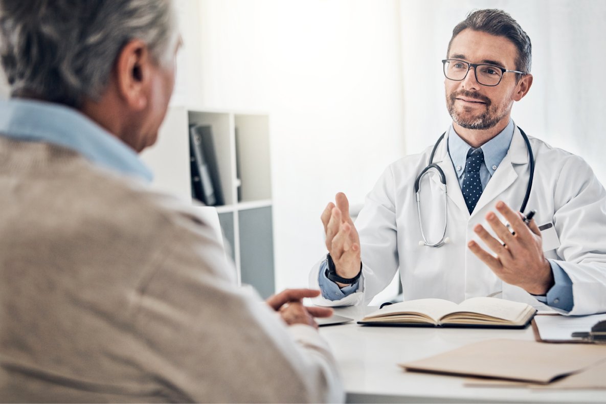 Doctor greeting a new adult patient with a handshake — Townsen Physician Group, Houston
