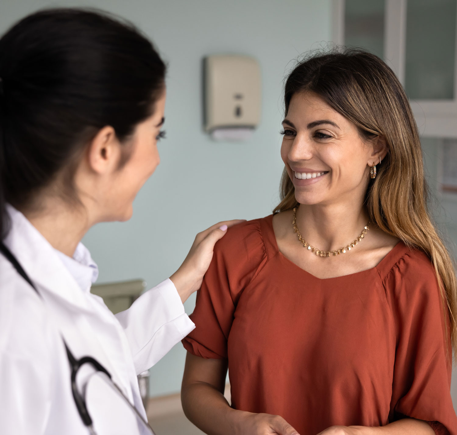 male doctor consulting a female patient