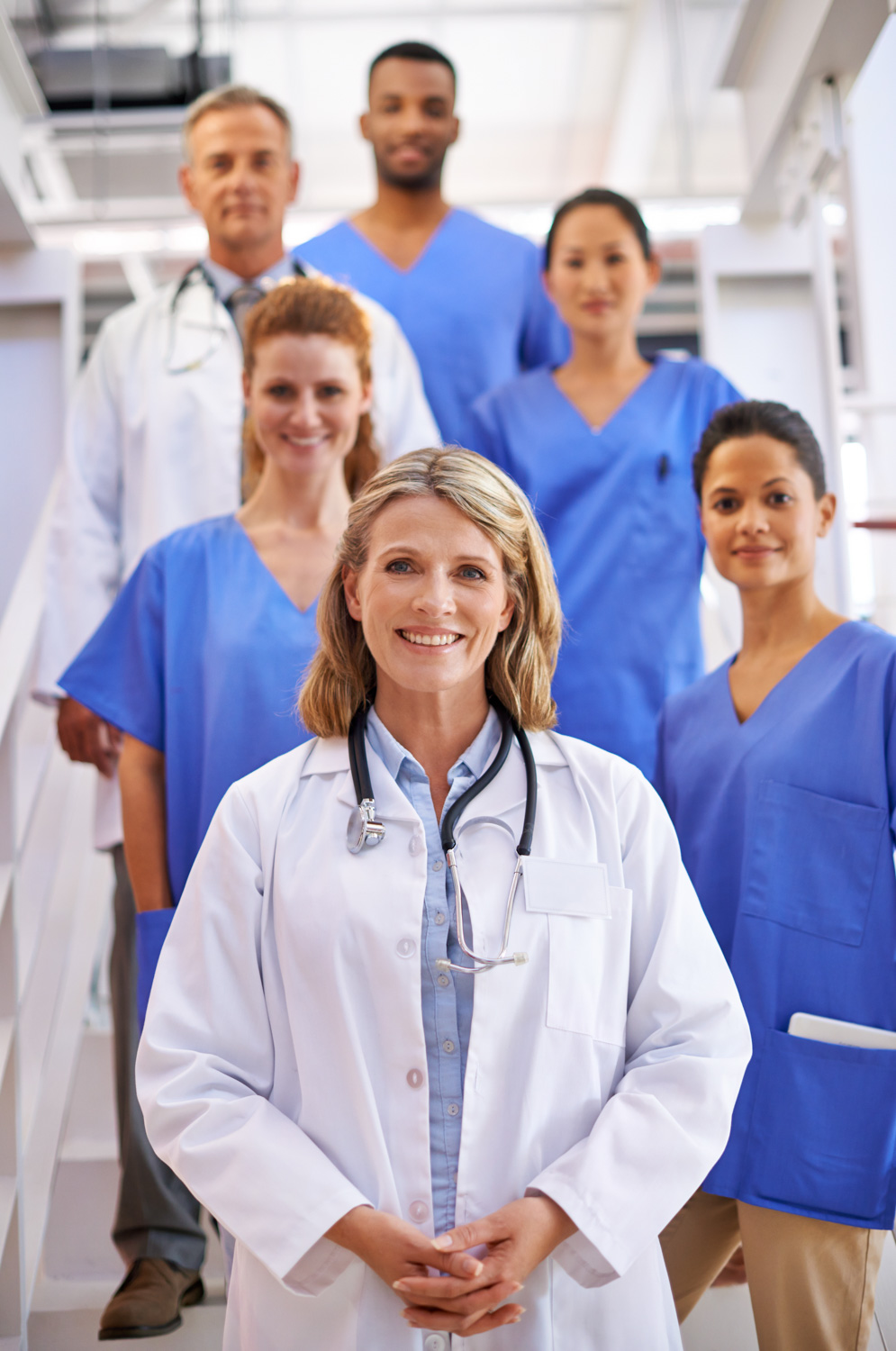 female doctor with medical crew behind her
