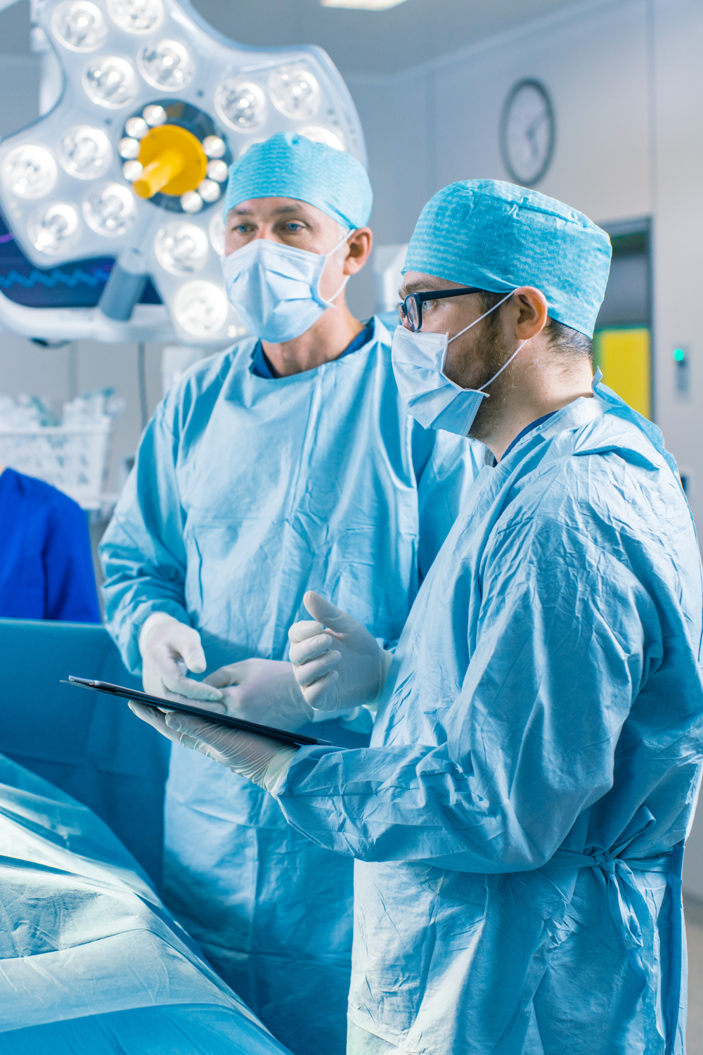two surgeons receiving instructions