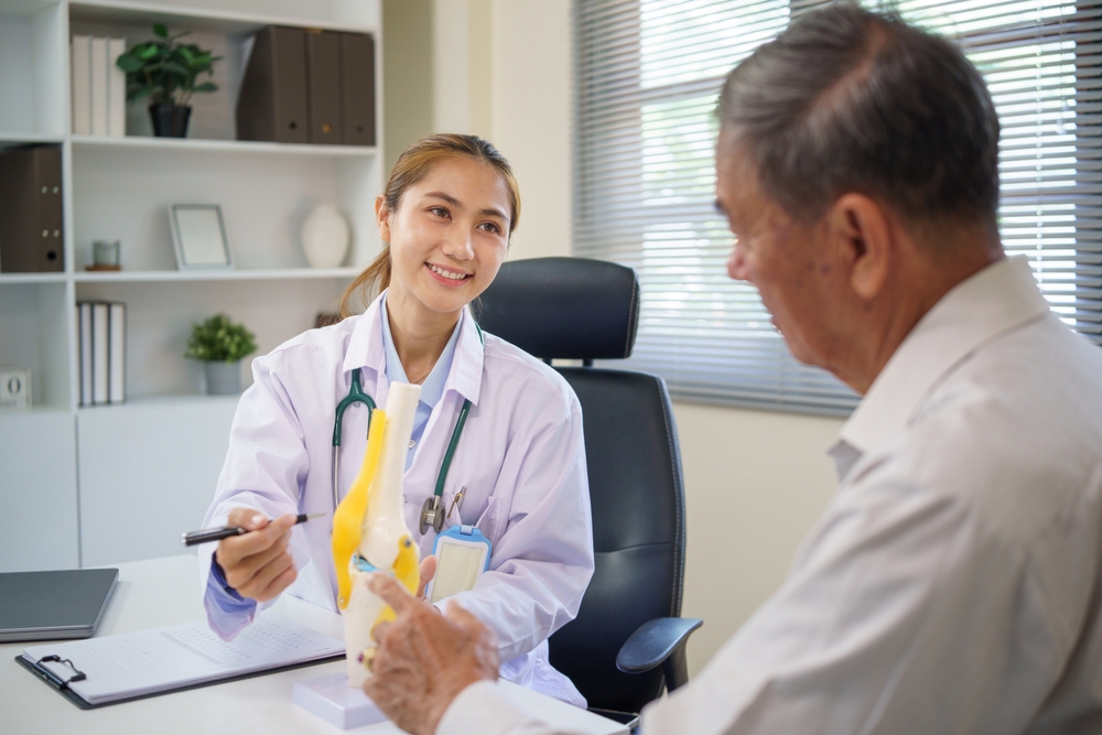 female doctor consult with elderly patient