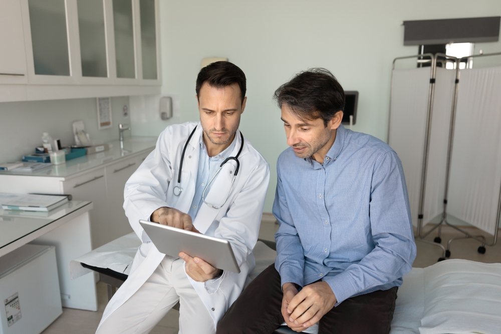 general practitioner showing lab results to patient
