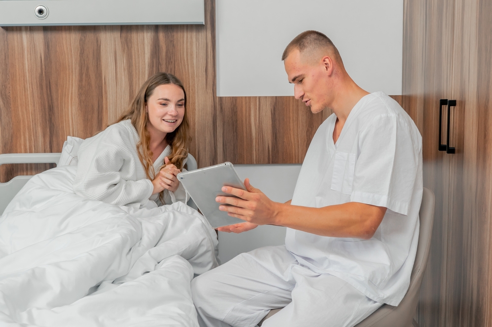 male sleep specialist conversing with a patient 
