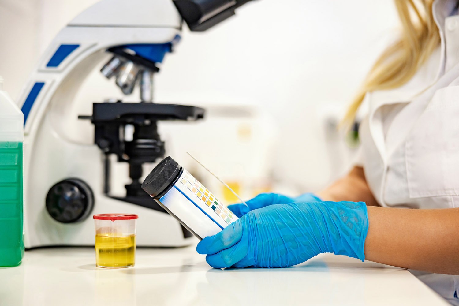 lab technician testing urine sample