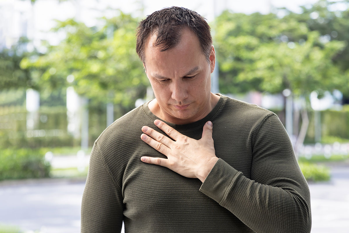 female nurse listening to elderly woman's heartbeat