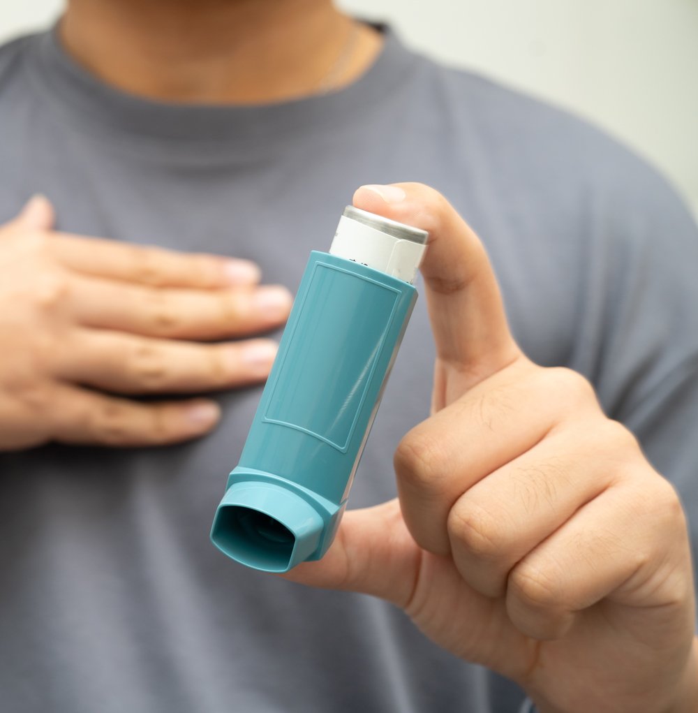 Man with Asthma Holding Inhaler