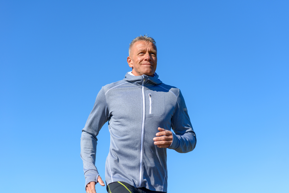 Healthy middle-aged man jogging