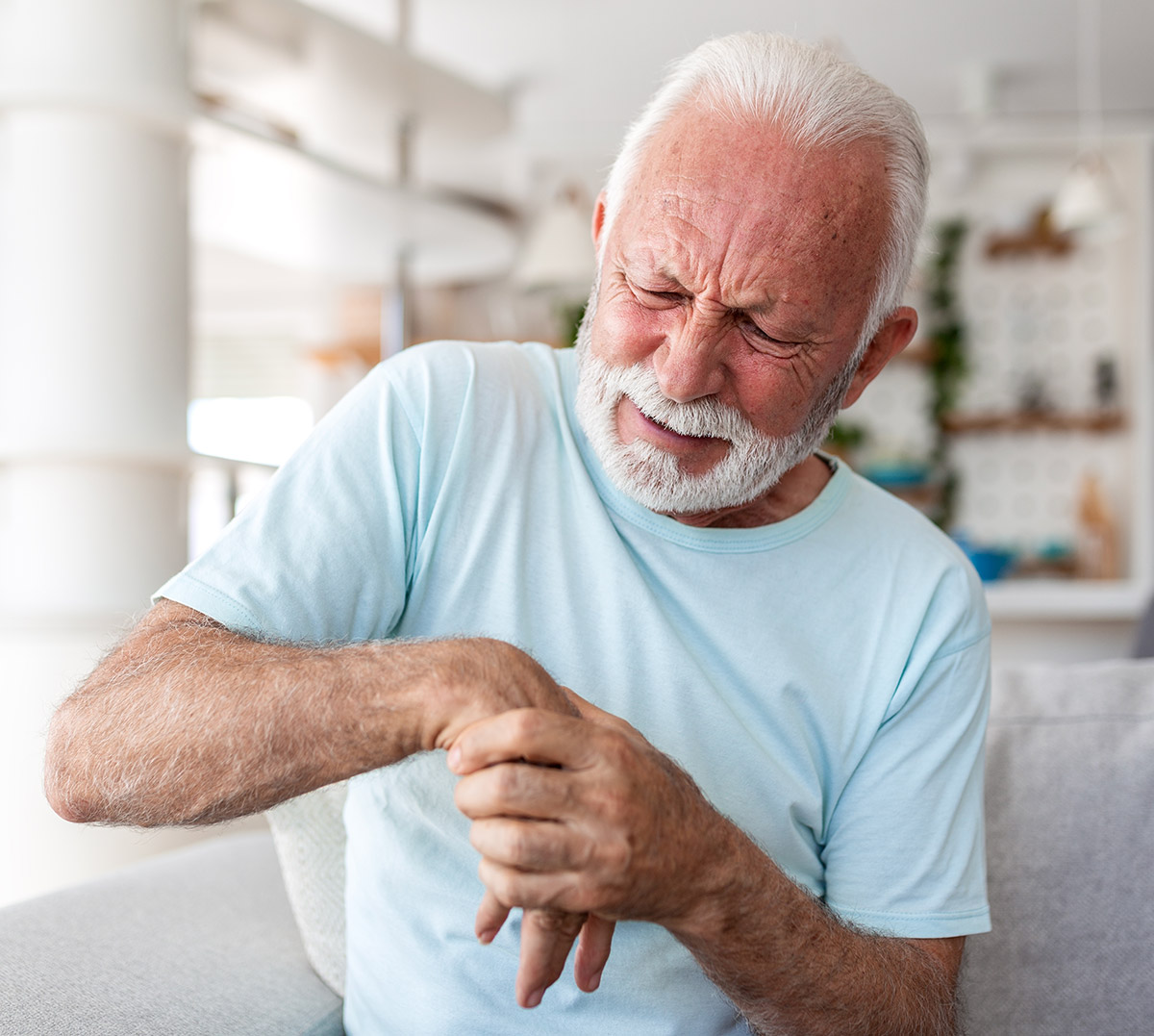 Elderly Man Touching Hand