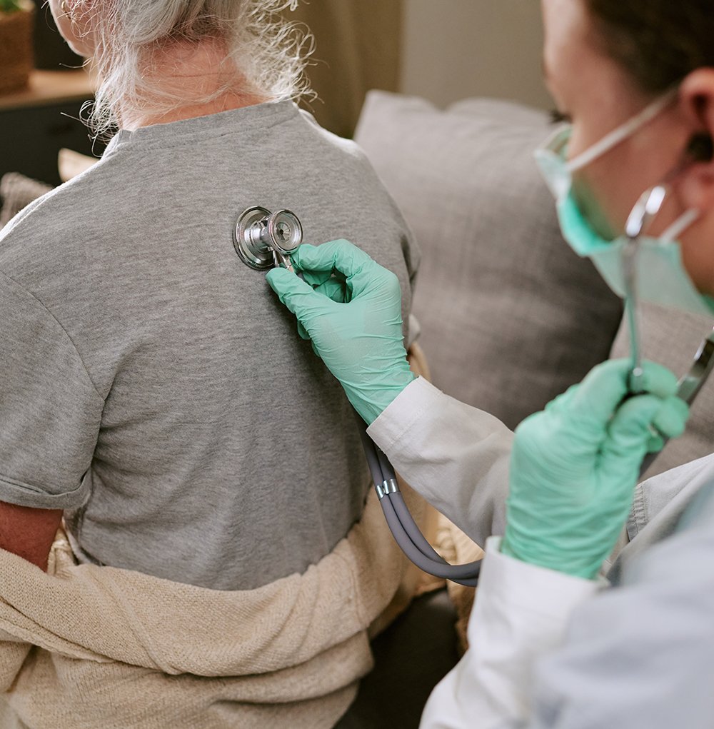 Female Doctor Checking Patient's Breathing