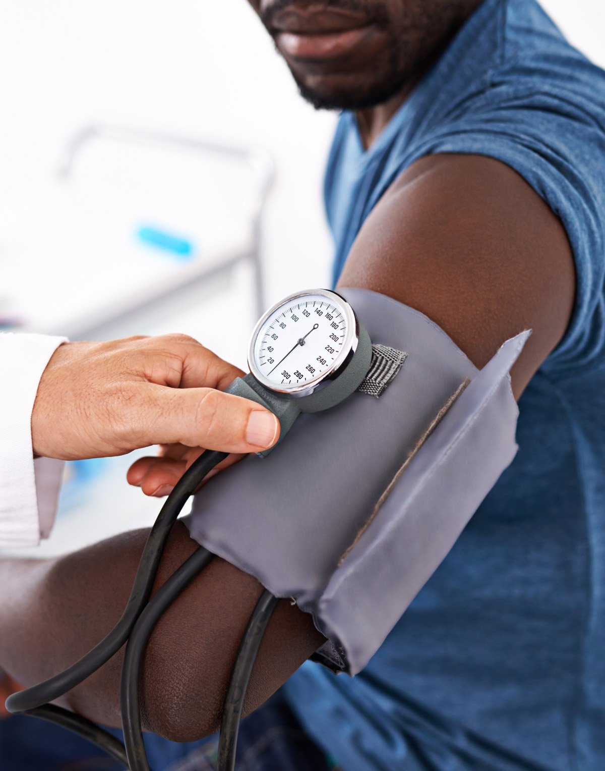 Physician checking a patient’s blood pressure at Townsen Physician Group in Houston