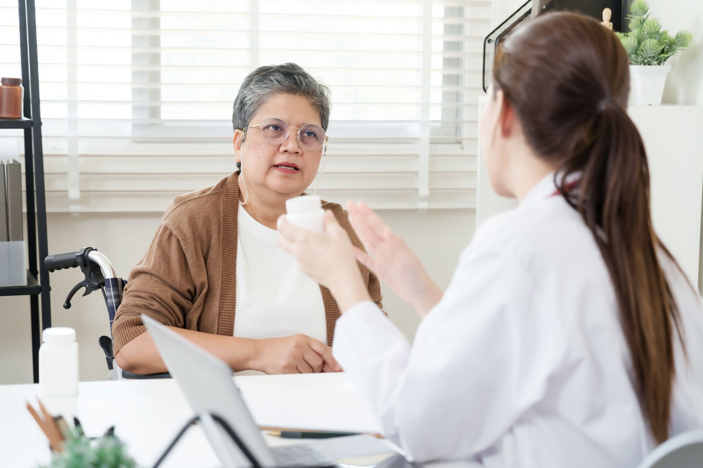 Doctor Explaining to Elderly Patient Her Medications