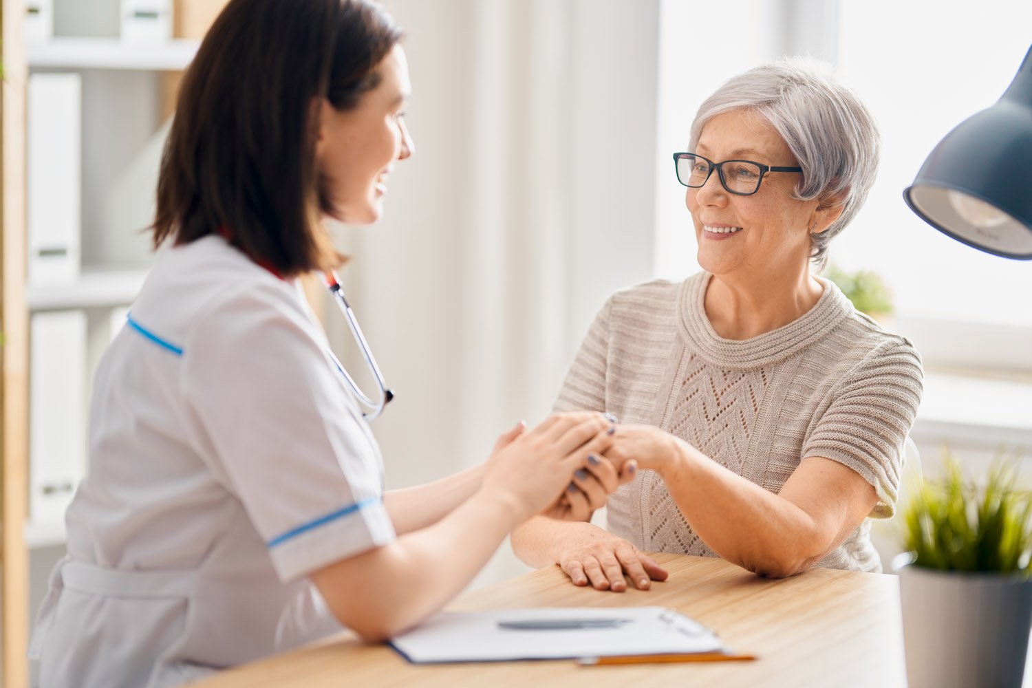 patient listening to doctor in medical office